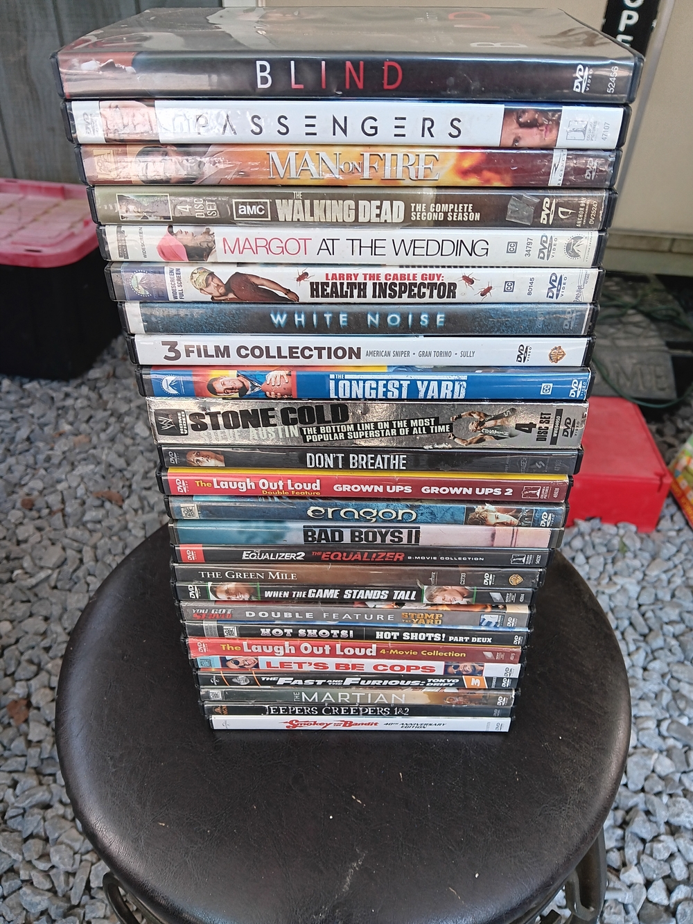 Stack of Assorted DVD Movie Cases - Black